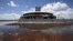 The base of a control tower at an abandoned construction site of a Mexico City airport that was scrapped two years ago sits flooded by summer rains, in Texcoco on the outskirts of Mexico City, Mexico, Sept. 3, 2020.