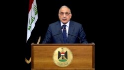 FILE - Iraqi Prime Minister Adel Abdul Mahdi gives a televised speech in Baghdad, Iraq, Oct. 9, 2019.