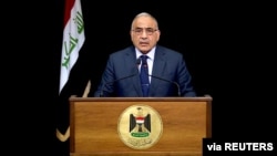 FILE - Iraqi Prime Minister Adel Abdul Mahdi gives a televised speech in Baghdad, Iraq, Oct. 9, 2019.