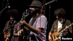 Behzad Omrani (C) of the Iranian band Bomrani performs at a concert in Tehran, Iran, Aug. 15, 2013 (Handout photo / Hamid Najafi)