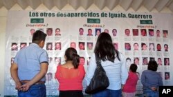 Photographs of the missing are on display at the future site of the Victims' City in Iguala, Guerrero State, Mexico, Nov. 22, 206.