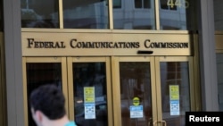 FILE - Signage is seen at the headquarters of the Federal Communications Commission in Washington, Aug. 29, 2020. A U.S. appeals court ruled on Dec. 31, 2024, that the FCC did not have the legal authority to reinstate landmark net neutrality rules.