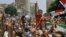 Egyptian supporters of President Mohammed Morsi shout slogans during a rally in front of Egypt's state council to announce their support after a decree by Morsi to reinstate the Parliament in Cairo, Egypt, July 10, 2012.