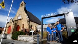 Nick Benoot poses with his family outside the Hooge Crater Museum in Ypres, Belgium, Nov. 4, 2021. 