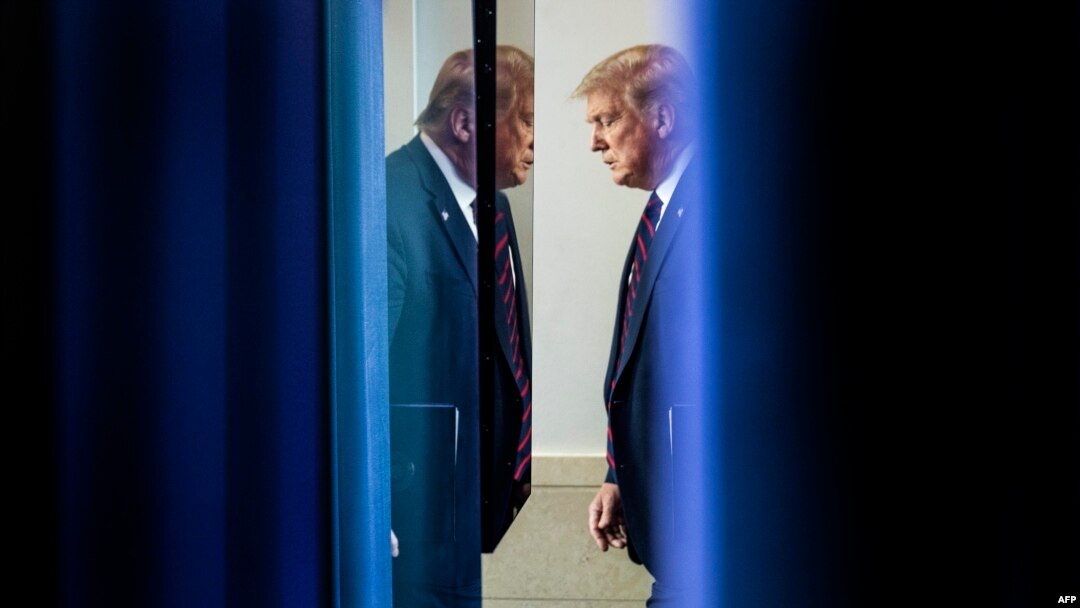 FILE - US President Donald Trump arrives to speak at the press briefing at the White House in Washington, DC, on July 30, 2020.