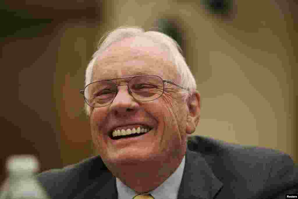 Neil Armstrong, commander of Apollo 11 and the first man on the moon, laughs during testimony before a House Science, Space and Technology committee hearing in Washington, September 22, 2011.
