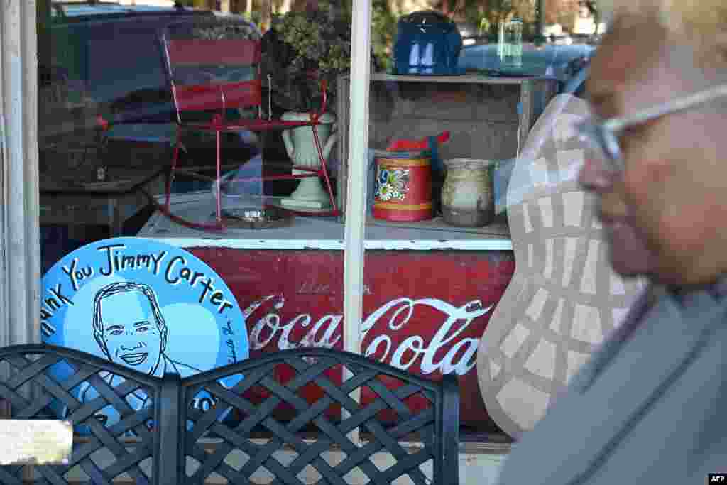 A sign in memory of Jimmy Carter is on display on a storefront at the Jimmy Carter National Historic Park in Plains, Georgia, Dec. 30, 2024.