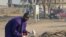 Mallam Muhammadu scavenges a trash dump in the city of Yola, in northeastern Adamawa state, Nigeria, February 14, 2012. He uses the bullhorn to announce his arrival in neighborhoods, where offers to buy unwanted items he can fix and sell.