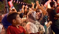 People show support for Nabil Karoui at a final rally in Tunis, Tunisia, Sept. 13, 2019. (L. Bryant/VOA)