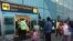 Passengers stand at a distance and wear masks amid the COVID-19 pandemic as they wait in line to check in at the Jorge Chávez International Airport in Callao, Peru, July 15, 2020.