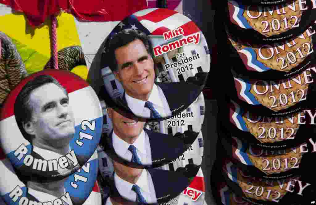 Buttons showing the likeness of Republican presidential candidate, former Massachusetts Gov. Mitt Romney, are seen at a vendor stand outside a campaign event in Milwaukee, Wisconsin, April 2, 2012. (AP)