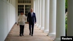 U.S. President Joe Biden and Philippines President Ferdinand Marcos Jr. walk on the West Colonnade to the Oval Office following a welcome ceremony at the White House in Washington, May 1, 2023. 