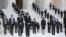 People wait for the casket of the late Supreme Court Justice Ruth Bader Ginsburg to arrive at the U.S. Supreme Court in Washington.