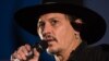 U.K. -- Actor Johnny Depp introduces his film, The Libertine, to the audience at 'Cineramageddon', the outdoor cinema venue, at the Glastonbury Festival of Music and Performing Arts on Worthy Farm near the village of Pilton in Somerset, June 22, 2017