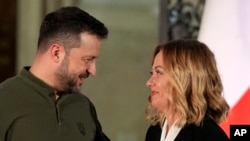 Italian Premier Giorgia Meloni smiles with Ukrainian President Volodymyr Zelenskyy aft  the property   conference, astatine  Villa Pamphilj, successful  Rome, Oct. 10, 2024.