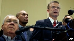 FBI Special Agent in Charge Richard DesLauriers, far right, speaks as Boston Mayor Thomas Menino, left, and Mass. Gov. Deval Patrick, center, listen during a news conference in Boston, April 16, 2013.