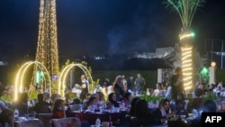 Iraqis sit at a popular café in the old city of Mosul on Sept. 2, 2024, seven years after the Islamist State (IS) group was ousted from the northern Iraqi city. 