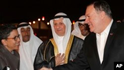 U.S. Secretary of State Mike Pompeo shakes hands with Ambassador Reem Al-Khaled, as he arrives at Kuwait International Airport in Kuwait City, Kuwait, March 19, 2019. 