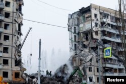 Росія здійснила ракетний удар по житловому будинку у Дніпрі. 15 січня 2023. REUTERS/Clodagh Kilcoyne