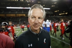 FILE - Cincinnati coach Tommy Tuberville walks off the field after the team's NCAA college football game against Memphis in Cincinnati, Nov. 18, 2016.