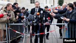 Louay Safi, spokesperson for the Syrian National Coalition, speaks to the media after a meeting at the Geneva Conference on Syria at the United Nations European headquarters in Geneva, January 30, 2014.