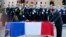 French President Francois Hollande pays his respect at the coffin of one of the two soldiers that died on Dec. 9 in Central African Republic, at the Invalides in Paris. 
