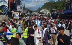 Supporters of Jammu and Kashmir Liberation Front march toward the Line of Control, in Muzaffarabad, the capital of Pakistani Kashmir, Oct. 5, 2019.