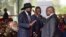 FILE— South Sudanese president Salva Kiir Mayardit, left, shakes hands with Pagan Amum Okiech, leader of the Real-SPLM group, during the launch of high-level peace talks for South Sudan at State House in Nairobi, Kenya, May 9, 2024. 
