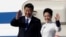 Chinese President Xi Jinping, left, and his wife Peng Liyuan wave upon arrival, Sept. 22, 2015, at Boeing Field in Everett, Wash.