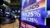 A television monitor on the floor of the New York Stock Exchange headlines the rate decision of the Federal Reserve, July 31, 2019.