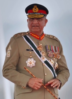 In this March 23, 2019 photo, Pakistan's Army Chief Gen. Qamar Javed Bajwa attends a military parade in Islamabad, Pakistan.