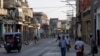 FILE - People walk on a street after Cuba's national grid collapsed on Sunday, the fourth nationwide grid failure in less than a month, in Havana, Cuba August 3, 2026. REUTERS/Norlys Perez