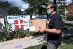 ROOH owner Manish Mallick delivers some of the 450 meals from his Indian restaurant for I Grow Chicago, in the Englewood neighborhood of Chicago, July 13, 2020.