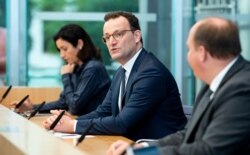 German Health Minister Jens Spahn attends a news conference to give an update on a smartphone app that allows users to evaluate their risk of being exposed to the coronavirus in Berlin, Germany, Sept. 23, 2020.