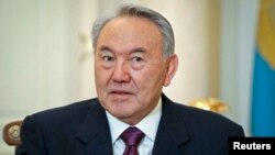 FILE - Kazakhstan's President Nursultan Nazarbayev attends a meeting at his office in Almaty, Feb. 25, 2013.