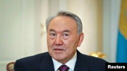 FILE - Kazakhstan's President Nursultan Nazarbayev attends a meeting at his office in Almaty, Feb. 25, 2013.