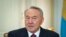 FILE - Kazakhstan's President Nursultan Nazarbayev attends a meeting at his office in Almaty, Feb. 25, 2013.