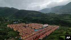 An aerial view shows new village houses built by the Chinese government for ethnic minority in Ganluo county, southwest China's Sichuan province on Sept. 10, 2020.