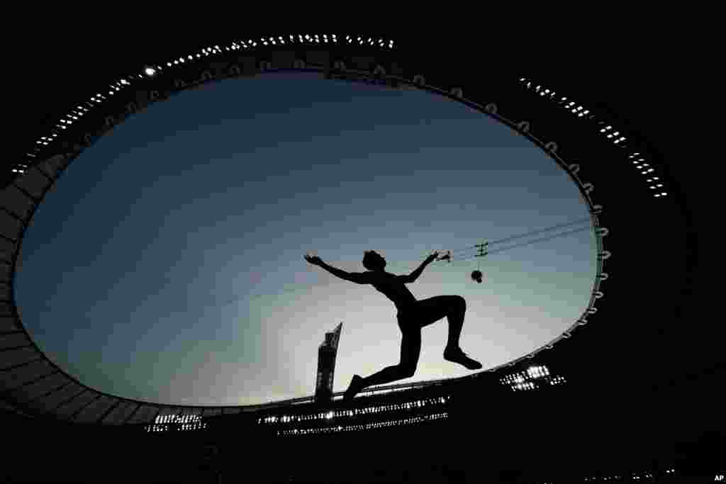 An athlete competes during the qualifications for the men&#39;s long jump event at the World Athletics Championships in Doha, Qatar.