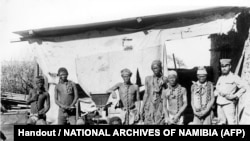 FILE—This undated file photo taken during the 1904-1908 war of Germany against Herero and Nama in Namibia shows a soldier (R) probably belonging to the German troops supervising Namibian war prisoners. 