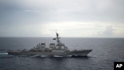 FILE - This photo provided by the U.S. Navy shows the guided-missile destroyer USS Decatur (DDG 73) operating in the South China Sea, Oct. 13, 2016.