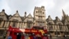 FILE - A sightseeing bus passes Oxford University building, amid the spread of the coronavirus disease (COVID-19), in Oxford, Britain, Oct. 6, 2020. 