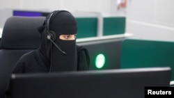 A Saudi woman works inside the first all-female call center in the kingdom's security sector, in the holy city of Mecca, Saudi Arabia, Aug. 29, 2017