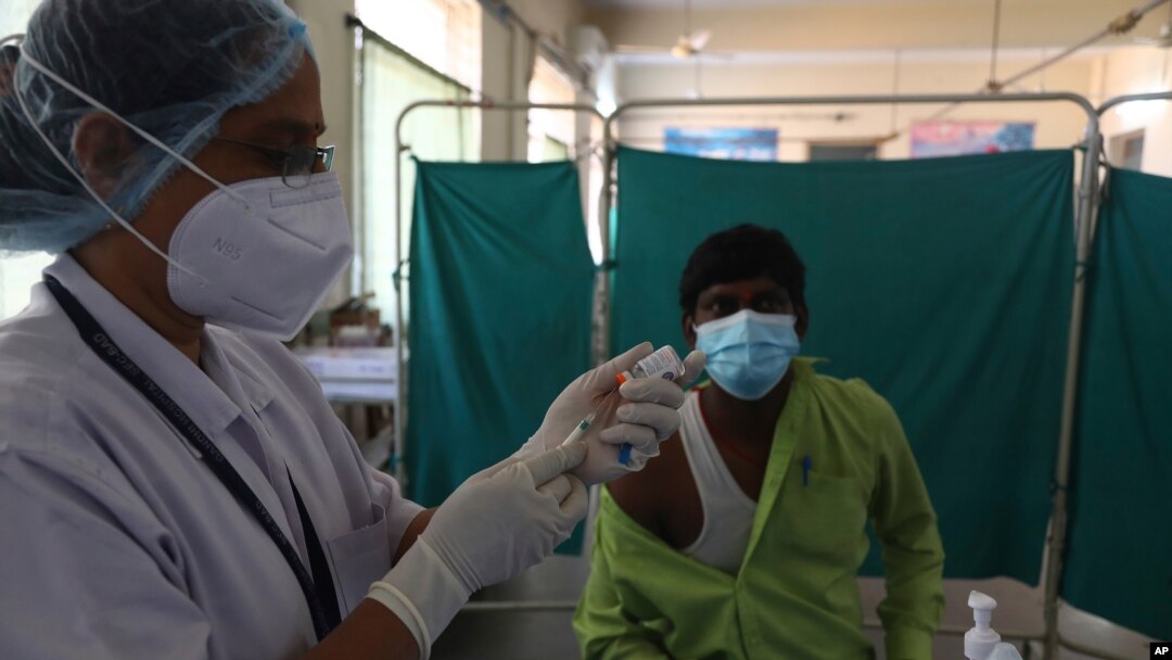 A health worker participates in a COVID-19 vaccine delivery system trial in Hyderabad, India, Jan. 2, 2021.