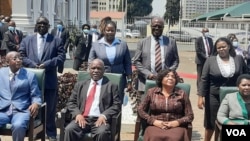 Center: Chief Justice Luke Malaba and his deputy Justice Elizabeth Gwaunza