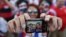 Costa Rica soccer fans pose for a selfie before watching their team's World Cup round of 16 match against Greece on a live telecast inside the FIFA Fan Fest area on Copacabana beach in Rio de Janeiro, Brazil, June 29, 2014.