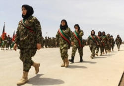 Afghan women soldiers march during the 22nd anniversary of the victory of the Afghan Mujahideen, in Herat on April 28, 2014.