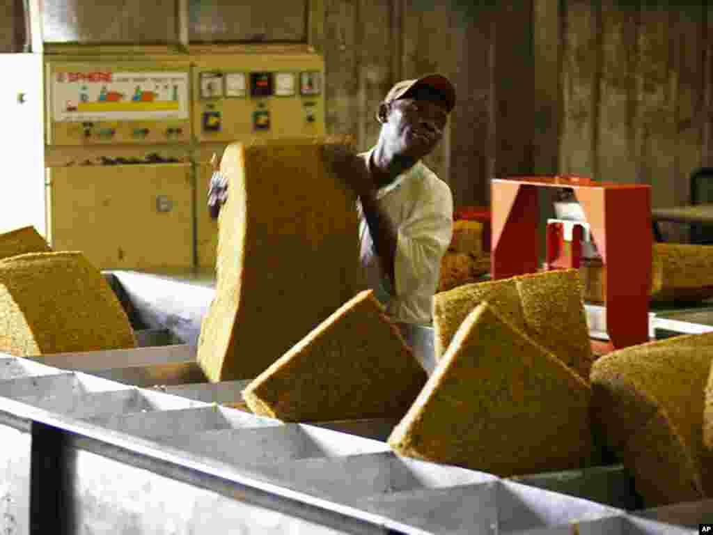 A worker at investor company SIATmanufacturing plant in Gabon