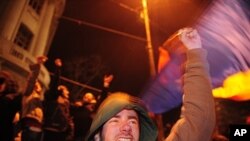 A protester shouts anti-presidential slogans in Piata Universitatii Square, Bucharest, Romania, January 19, 2012.