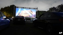 Filmgoers attend the "Nomadland" screening at the Queens Drive-In at the New York Hall of Science during the 58th New York Film Festival on Saturday, Sept. 26, 2020, in New York. (Photo by Evan Agostini/Invision/AP)